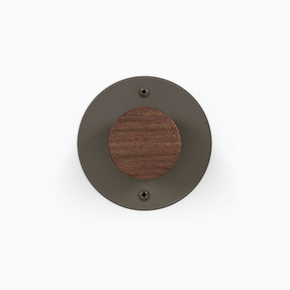 Runda Coat Rack 1 round dark metal wall hook with a wood center for entryway organization