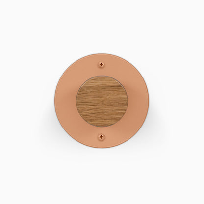 Runda Coat Rack 1 round copper wall hook with a warm wood center and two visible mounting screws