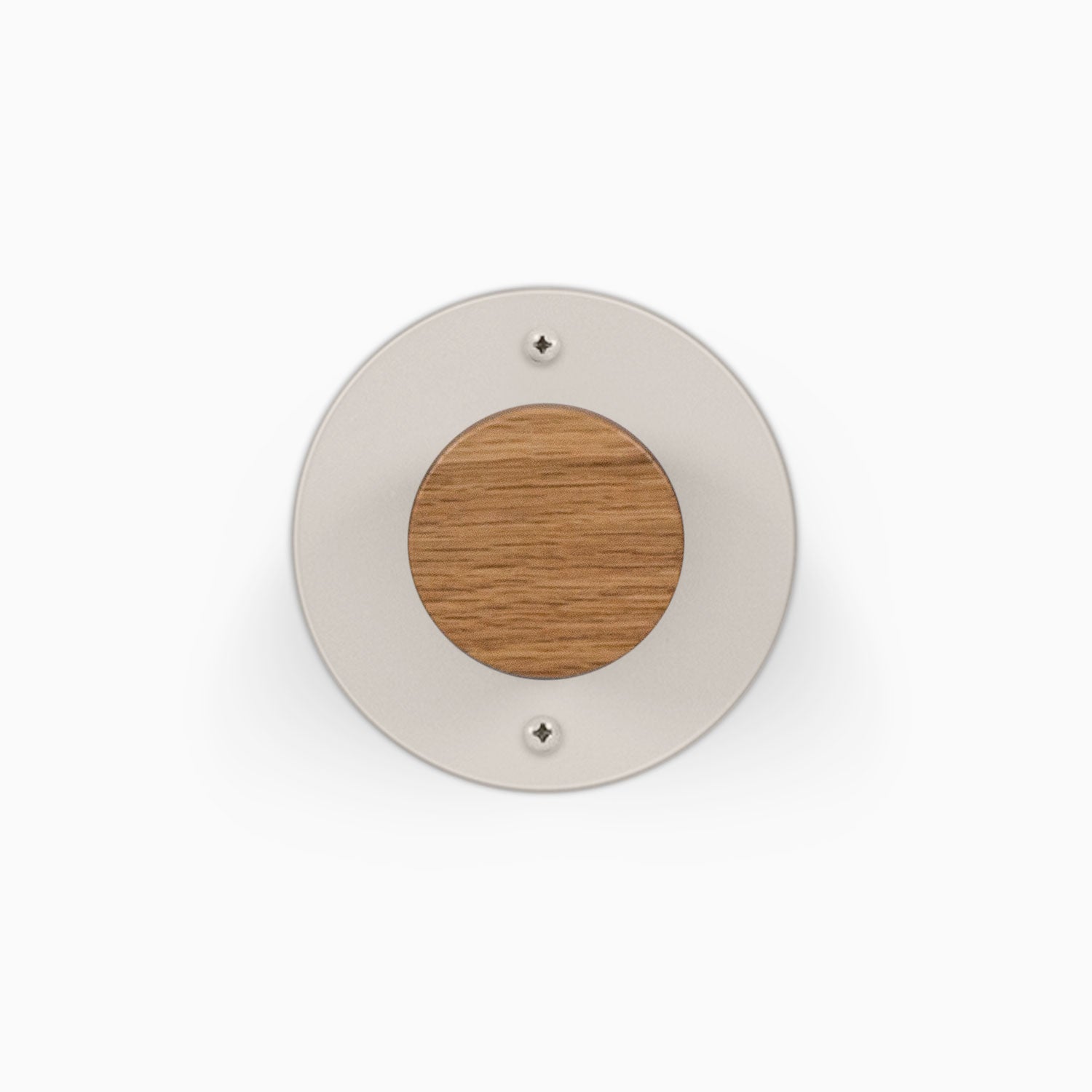 Runda Coat Rack 1 round wall mounted coat rack with a light metal plate wood center and two visible mounting screws