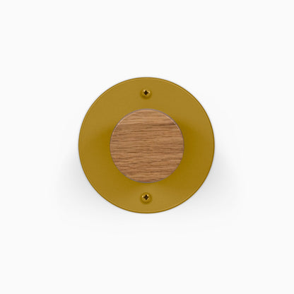 Runda Coat Rack 1 circular gold wall hook with a solid hardwood center and two visible mounting screws for organized entryway storage