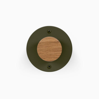Runda Coat Rack 1 round dark metal wall hook with a centered solid wood peg and two visible mounting screws