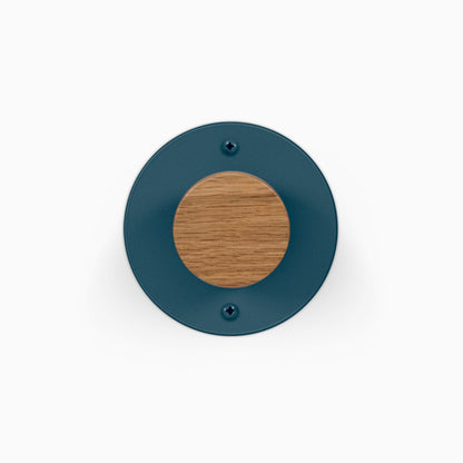 Runda Coat Rack 1 round teal wall hook with a wooden center and visible mounting screws on a white background