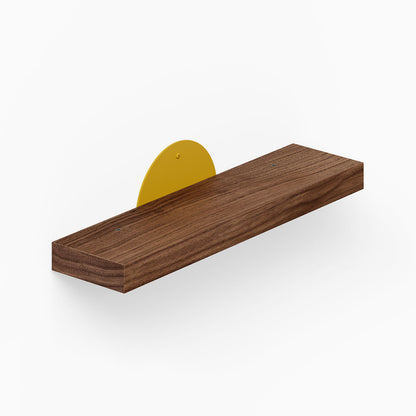Shortie Deux Wall Shelf features a minimalist solid hardwood platform with a vibrant yellow steel bracket, blending wood and metal for stylish wall display.