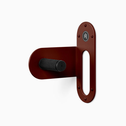 Spoke Bike Hanger – witchy rose color, left orientation. Modern wall or ceiling-mounted bike hanger by Shelfology, USA-made powder coated steel.