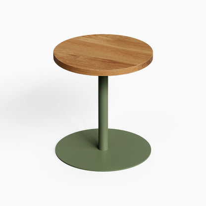 Spot On Side Table with a round wood top and green metal pedestal base for compact display and organization