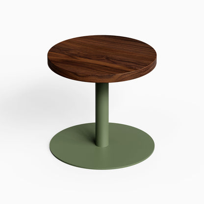 Spot On Side Table with a round dark wood top and green metal pedestal base for compact display and organization