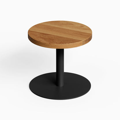 Spot On Side Table with round wood tabletop and black metal pedestal base for minimalist functional organization