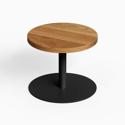 Minimalist Spot On Side Table with solid hardwood round top and sturdy black metal base, designed for functional modern living spaces.