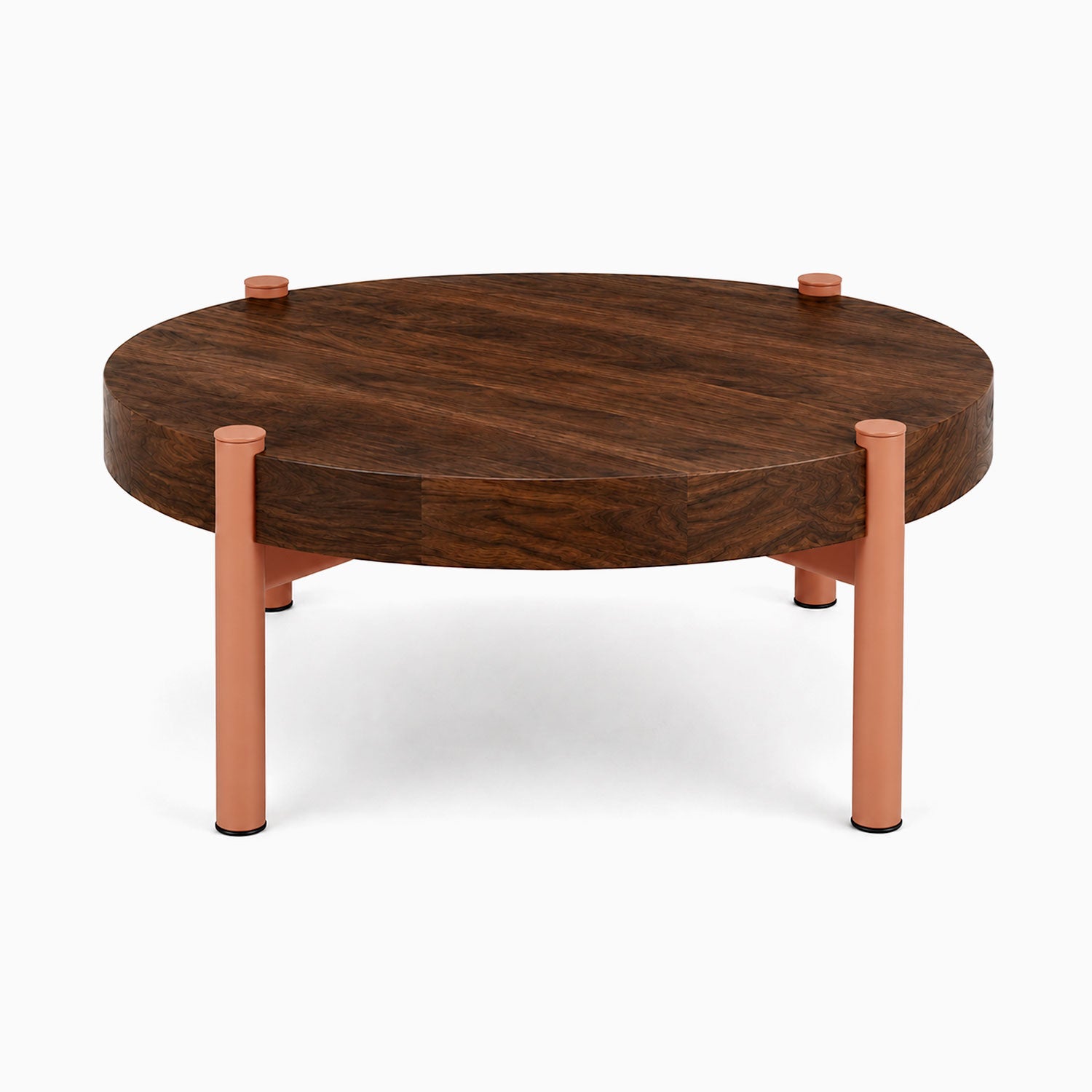 Stay Coffee Table with a round solid hardwood top and minimalist steel legs in a warm matte finish, blending modern design with function.