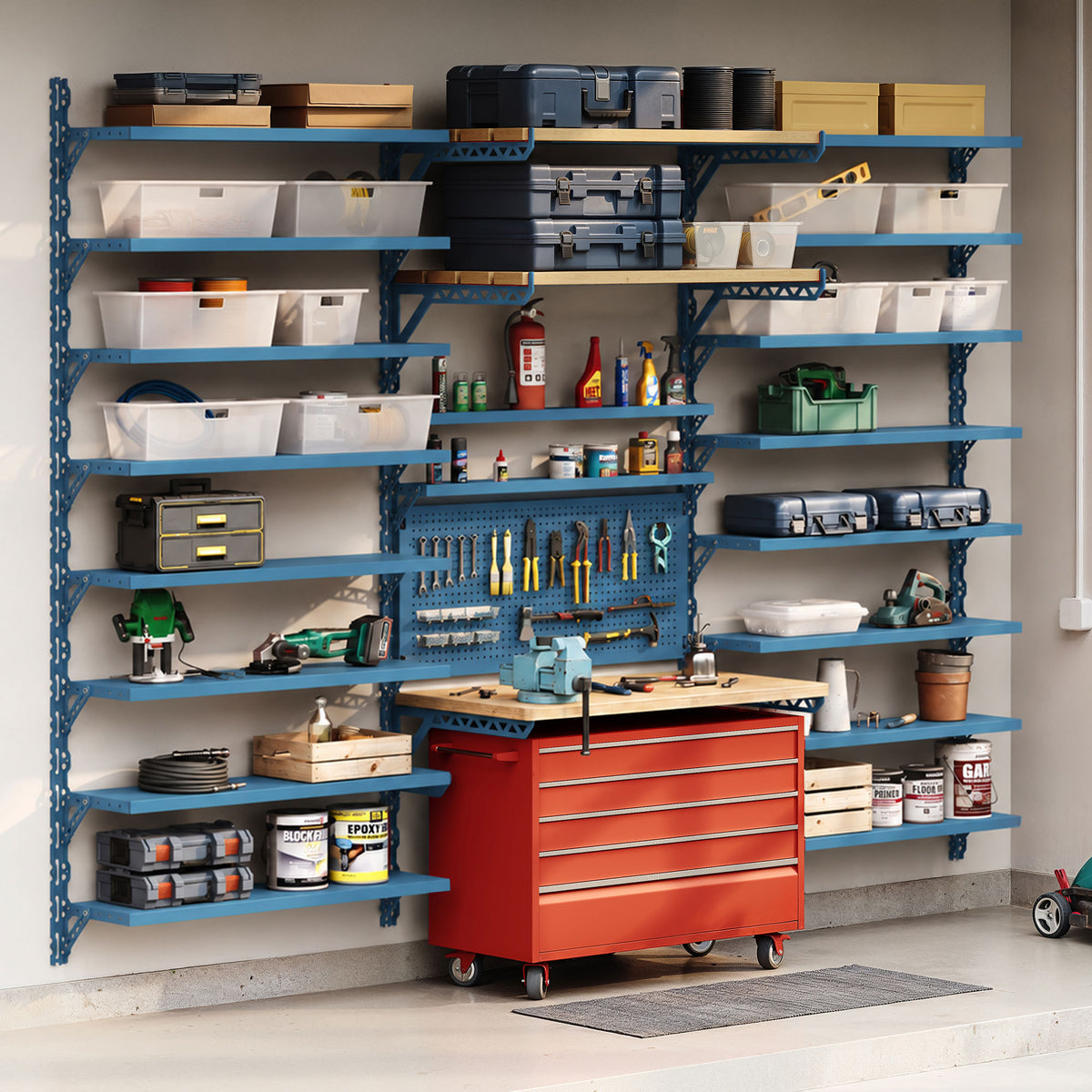 Organized garage workshop with blue wall shelving, storage bins, tools, supplies, and a red rolling tool cabinet.