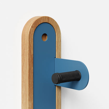 Wallride Vertical Bike Hanger System product image against white background. Upper section or hanger shown in white oak and shelf geek blue, right bracket  configuration. 