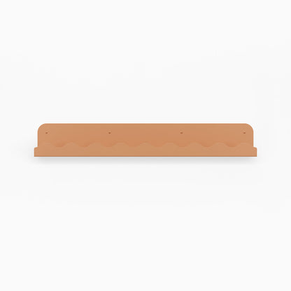 Mini Wave Picture Ledge in clay steel with subtle wave pattern for minimalist wall shelf and display organization solutions