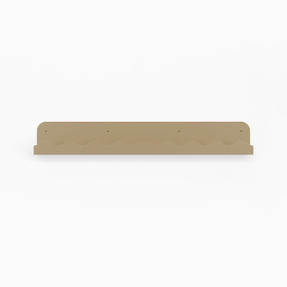 Mini Wave Picture Ledge in cowabunga steel with minimalist wave design for functional floating shelf and wall display organization