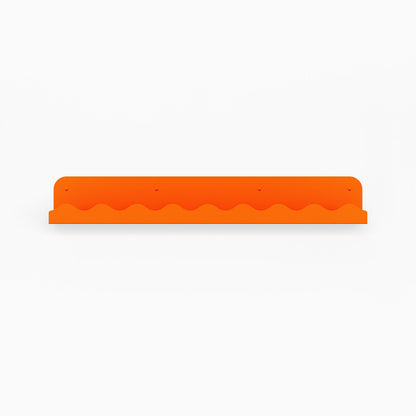 Mini Wave Picture Ledge in vibrant orange steel with compact wave pattern for modern floating shelf and wall display organization