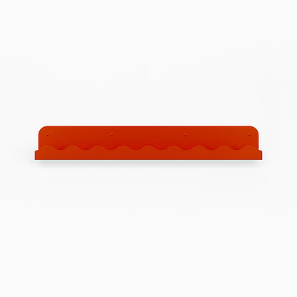 Mini Wave Picture Ledge in vibrant orange steel with distinctive wave pattern for modern wall shelf display and organization solutions