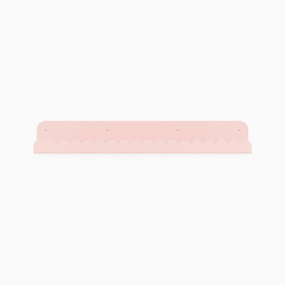 Mini Wave Picture Ledge in soft pink steel with gentle wave design for elegant floating shelf and wall display organization